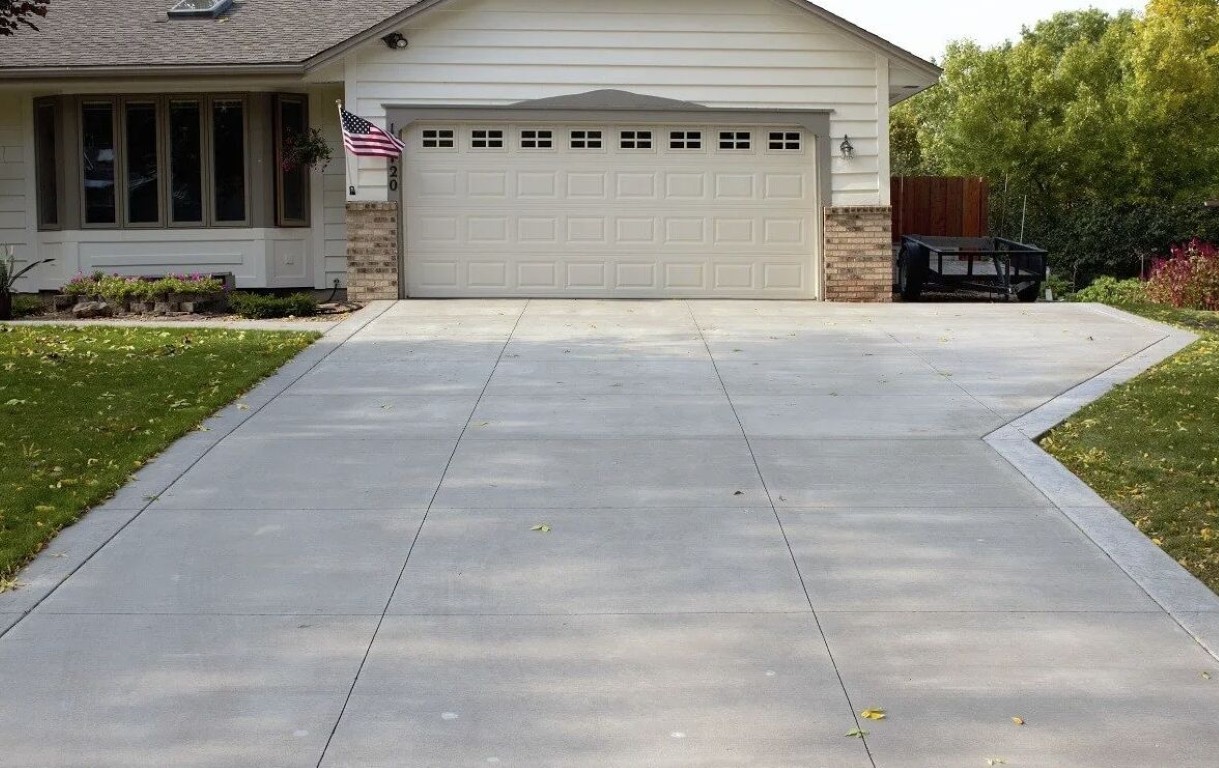Smooth concrete garage floor and driveway installation with expansion joints in Bradenton, FL